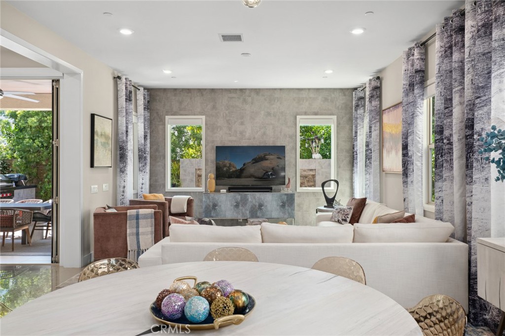 131 Spiral Irvine, CA 92618 - Photo 11 of 39 a living room with furniture and a large window