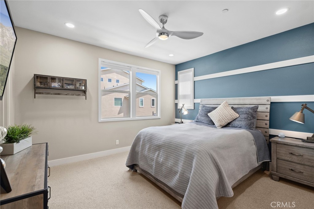 131 Spiral Irvine, CA 92618 - Photo 21 of 39 a bedroom with a bed and a potted plant