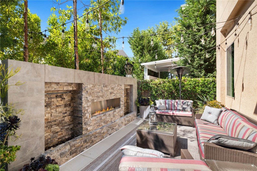 131 Spiral Irvine, CA 92618 - Photo 4 of 39 a outdoor living space with furniture and a fireplace