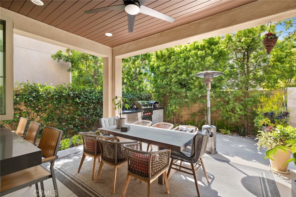 131 Spiral Irvine, CA 92618 - Photo 5 of 39 a view of an outdoor dining space with a table and chairs