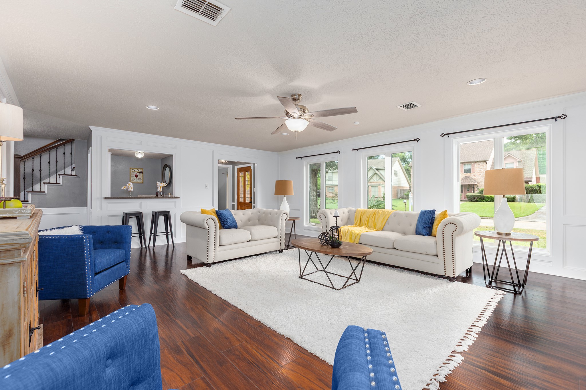 a living room with furniture and a large window