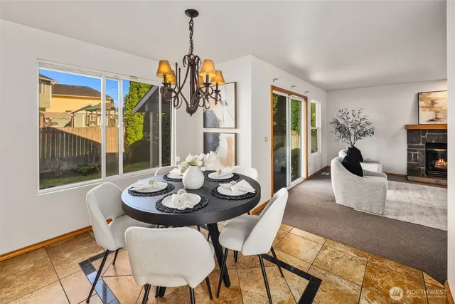 a view of a dining room with furniture window and outside view