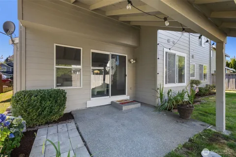 a view of a house with potted plants