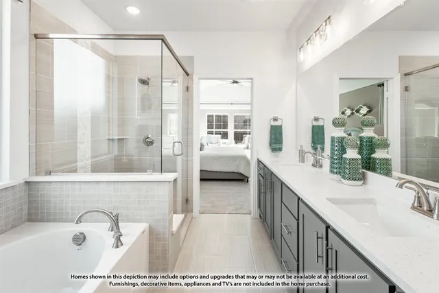 a bathroom with a double vanity sink shower and mirror