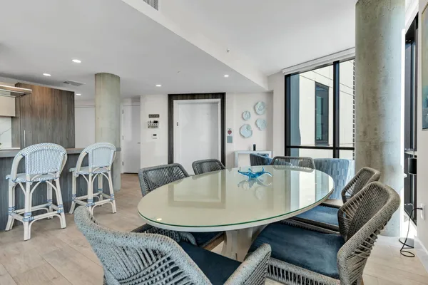 a dining room with furniture and wooden floor