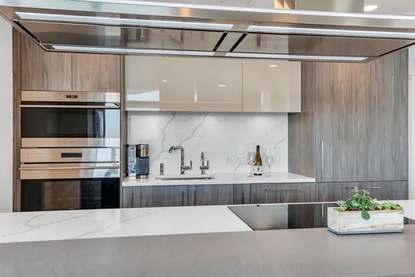 a kitchen with a stove and cabinets