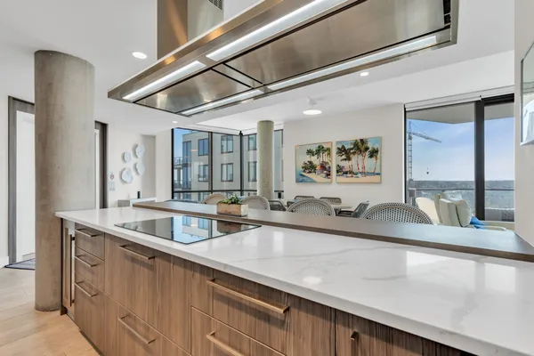 a kitchen with a sink and a large window