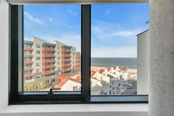 a room with gym equipment and a large window
