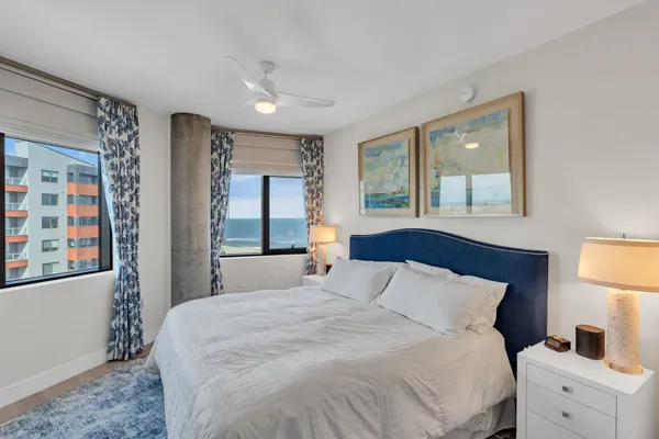 a bedroom with a large bed and a window