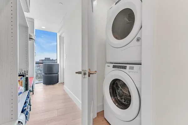 a bathroom with a sink a toilet a mirror and shower