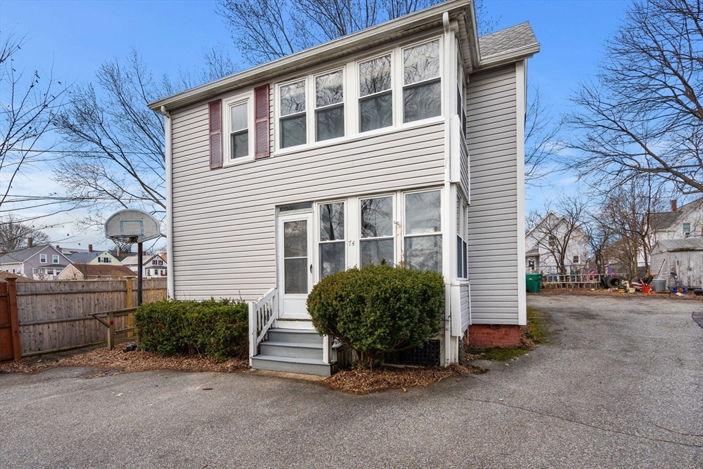 74-76 Myrtle Street Lynn, MA 01905 - Photo 3 of 3 a view of a house with a yard