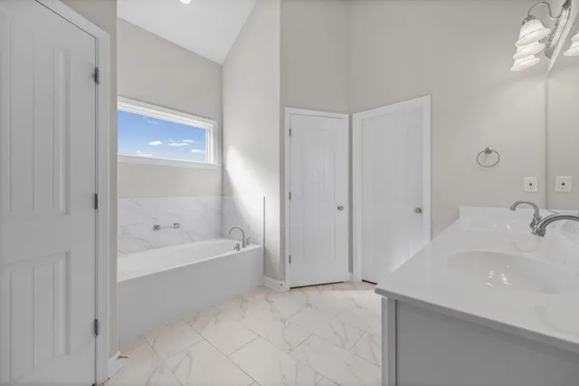 a bathroom with a bathtub and a sink