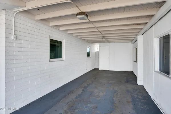 a view of an empty room with a window