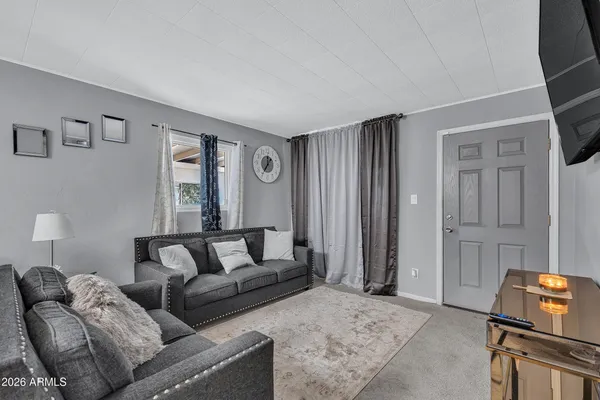 a living room with furniture and a window