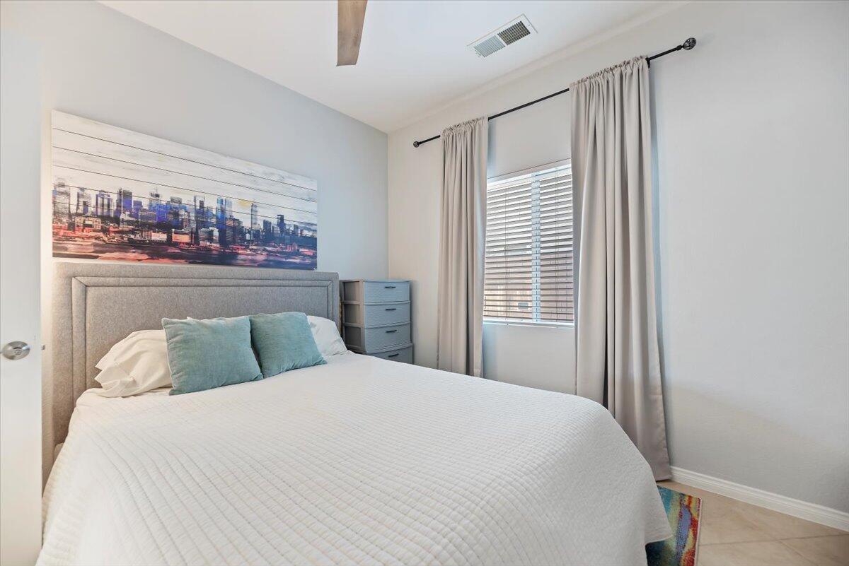 3982 Eastgate N Road Palm Springs, CA 92262 - Photo 18 of 55 a bedroom with a bed and a window