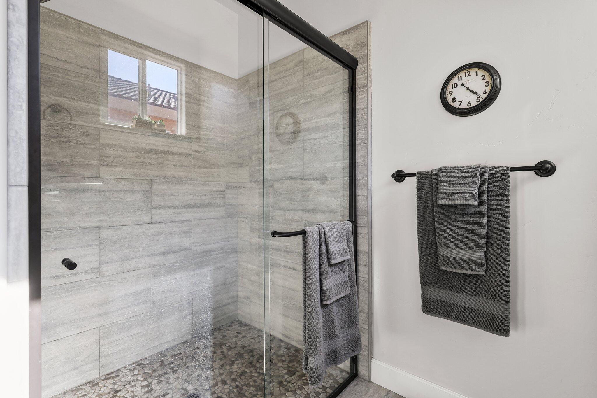 6180 Lucca Trail Redding, CA 96003 - Photo 16 of 42 a bathroom with a shower and a mirror