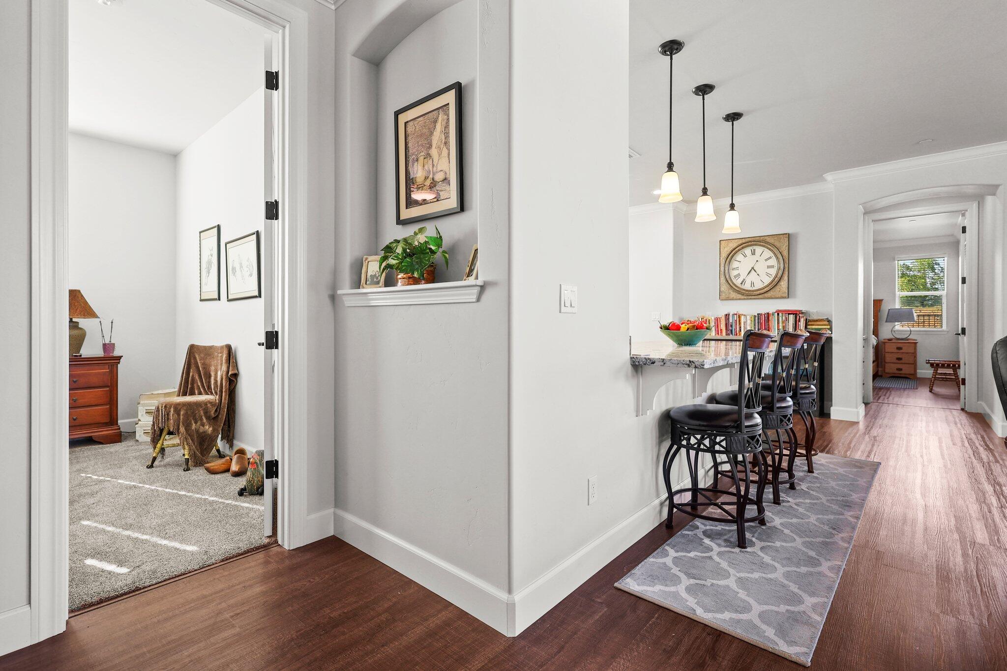 6180 Lucca Trail Redding, CA 96003 - Photo 19 of 42 a view of a livingroom with furniture and hardwood floor