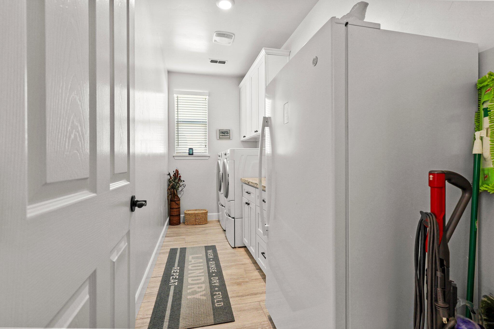 6180 Lucca Trail Redding, CA 96003 - Photo 29 of 42 a view of a hallway with wooden floor and staircase