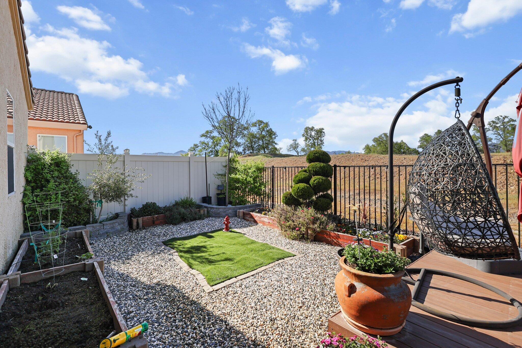 6180 Lucca Trail Redding, CA 96003 - Photo 32 of 42 a view of a backyard with sitting area