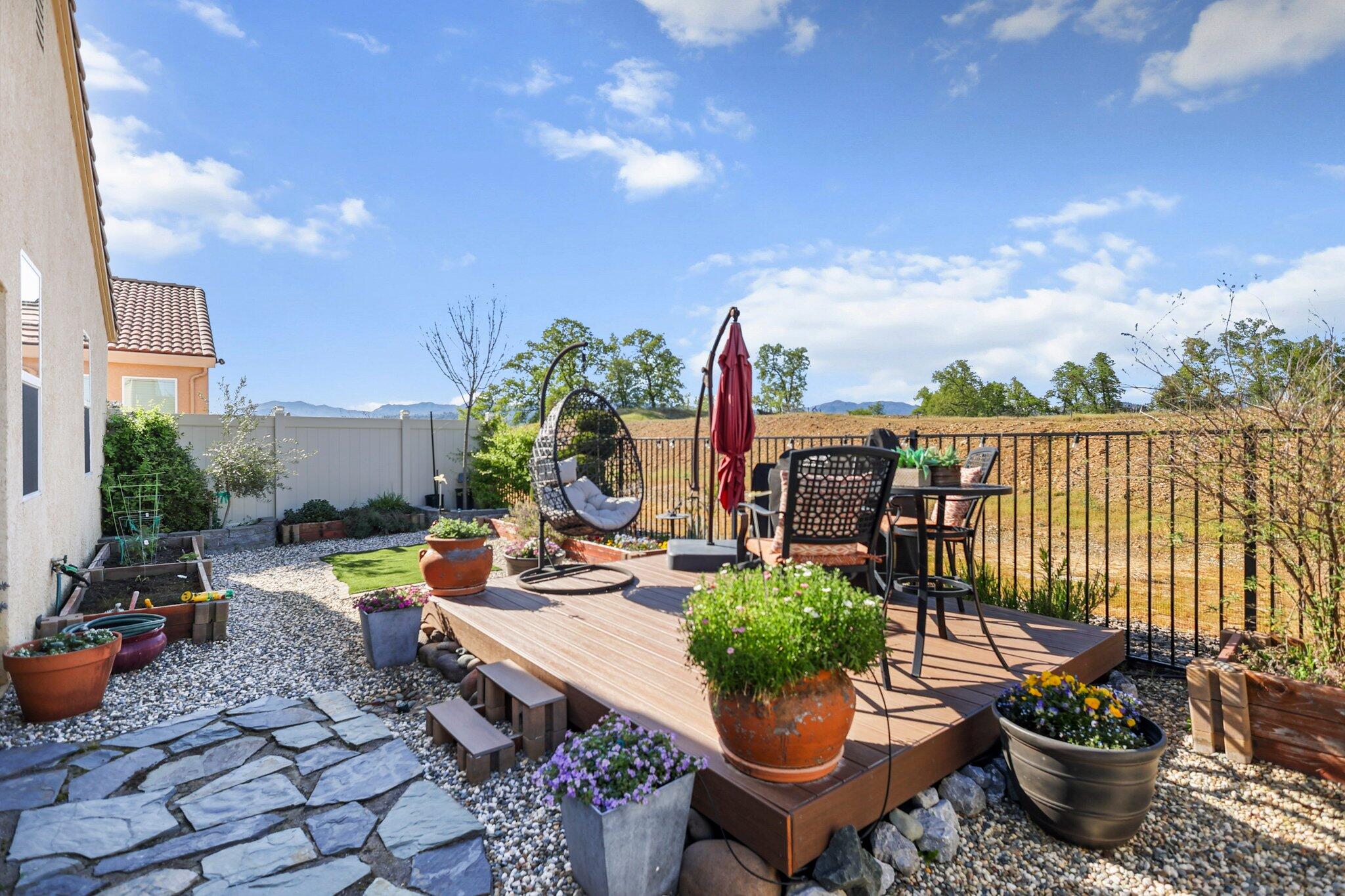 6180 Lucca Trail Redding, CA 96003 - Photo 34 of 42 a view of a backyard with sitting area and furniture