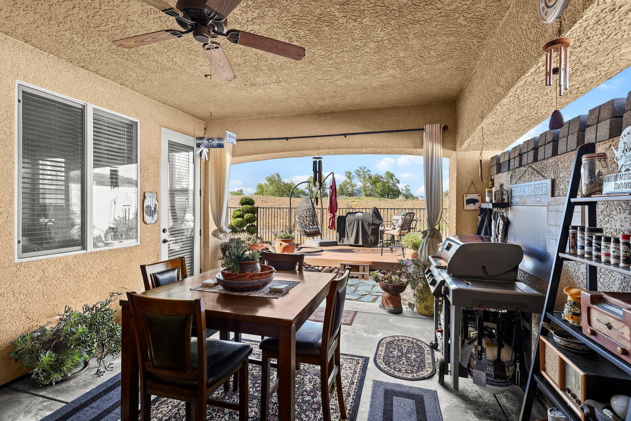 6180 Lucca Trail Redding, CA 96003 - Photo 36 of 42 a view of a dining room with furniture window and outside view