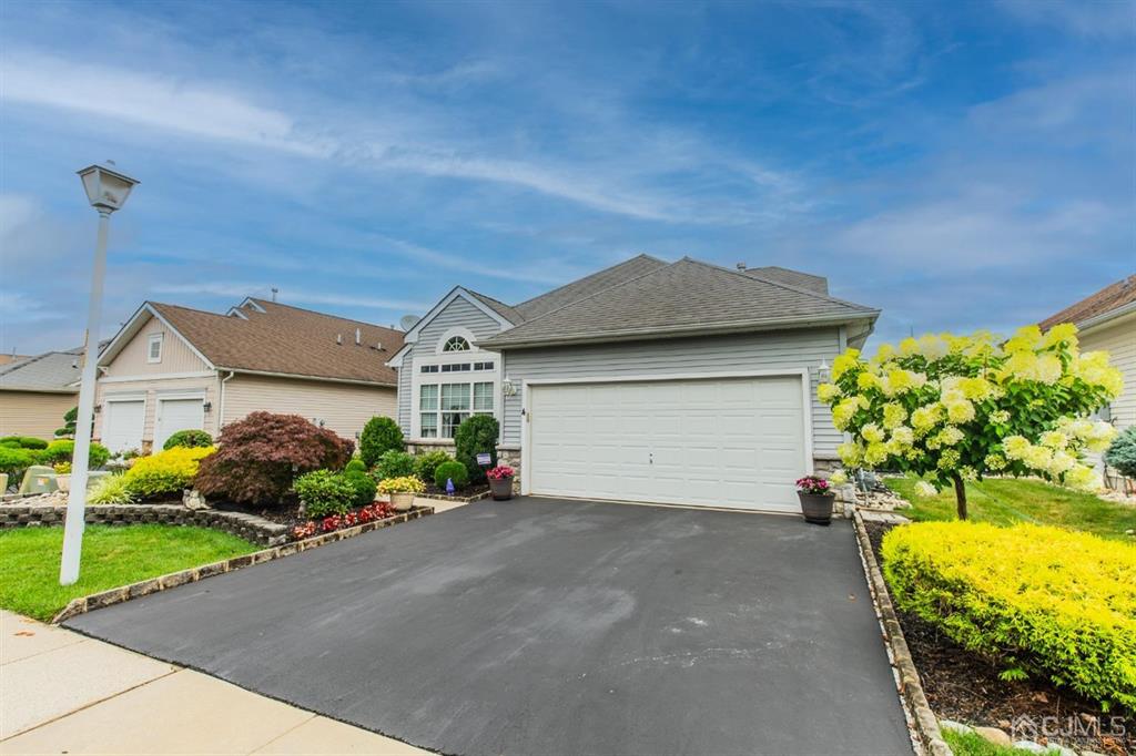 4 Merlot Court Monroe Township, NJ 08831 - Photo 1 of 17 a front view of a house with a yard and garage