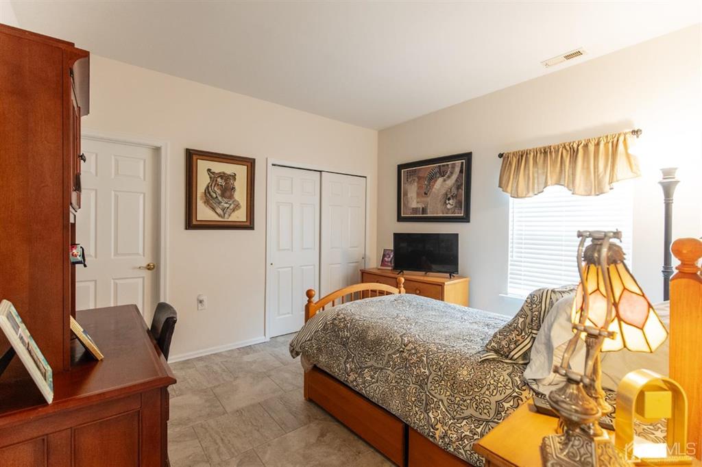 4 Merlot Court Monroe Township, NJ 08831 - Photo 11 of 17 a bedroom with a bed and wooden floor