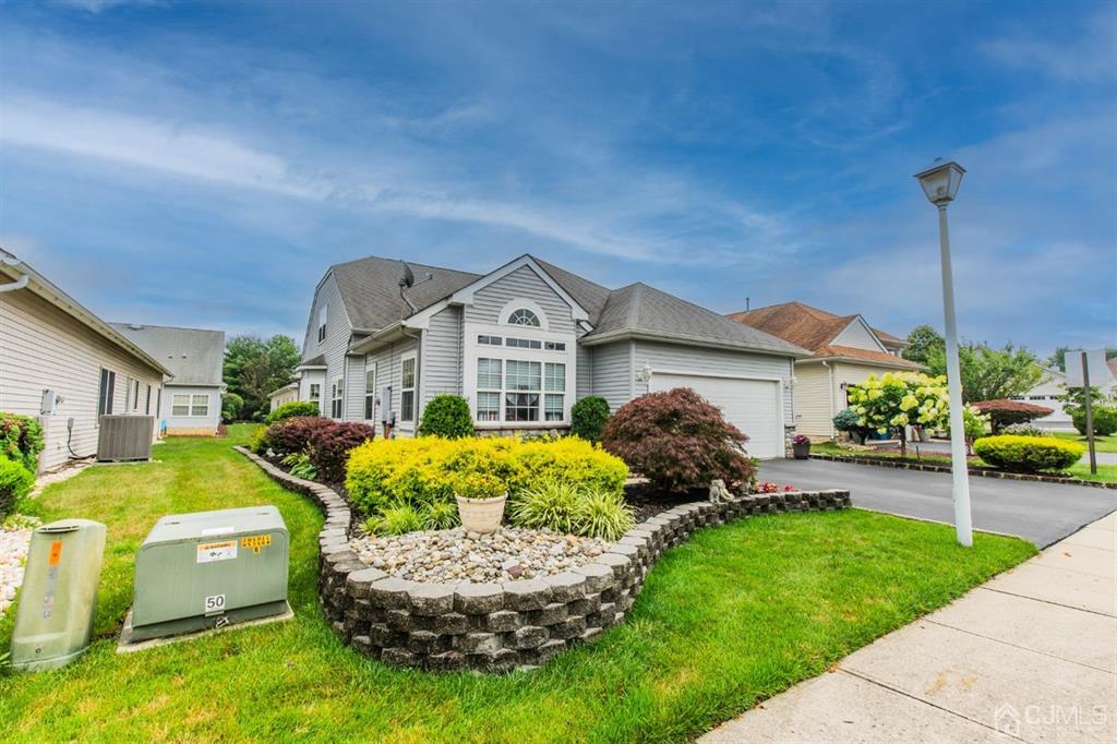 4 Merlot Court Monroe Township, NJ 08831 - Photo 17 of 17 a front view of a house with garden