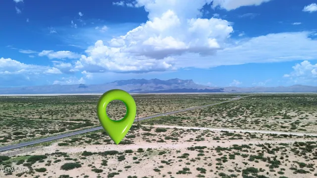 a view of a yard with wooden fence
