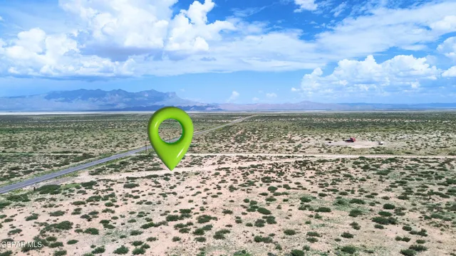 a view of a backyard of a house with a garden