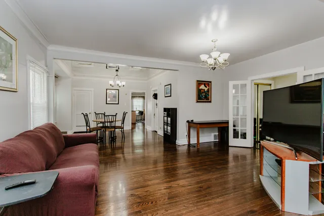 a view of a dining room with furniture and wooden floor