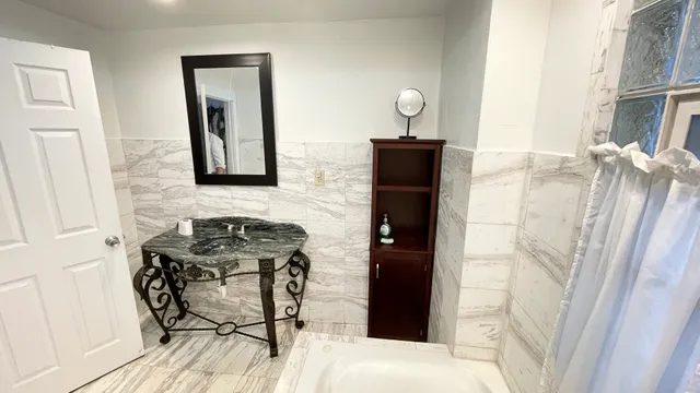 a bathroom with a sink and a mirror
