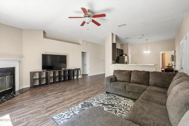 a living room with furniture and a flat screen tv