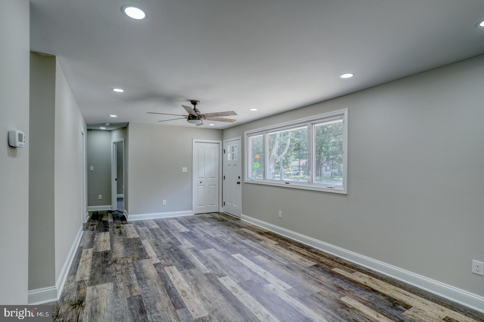 67 Morgans Choice Road Camden Wyoming, DE 19934 - Photo 13 of 56 wooden floor in an empty room with a window