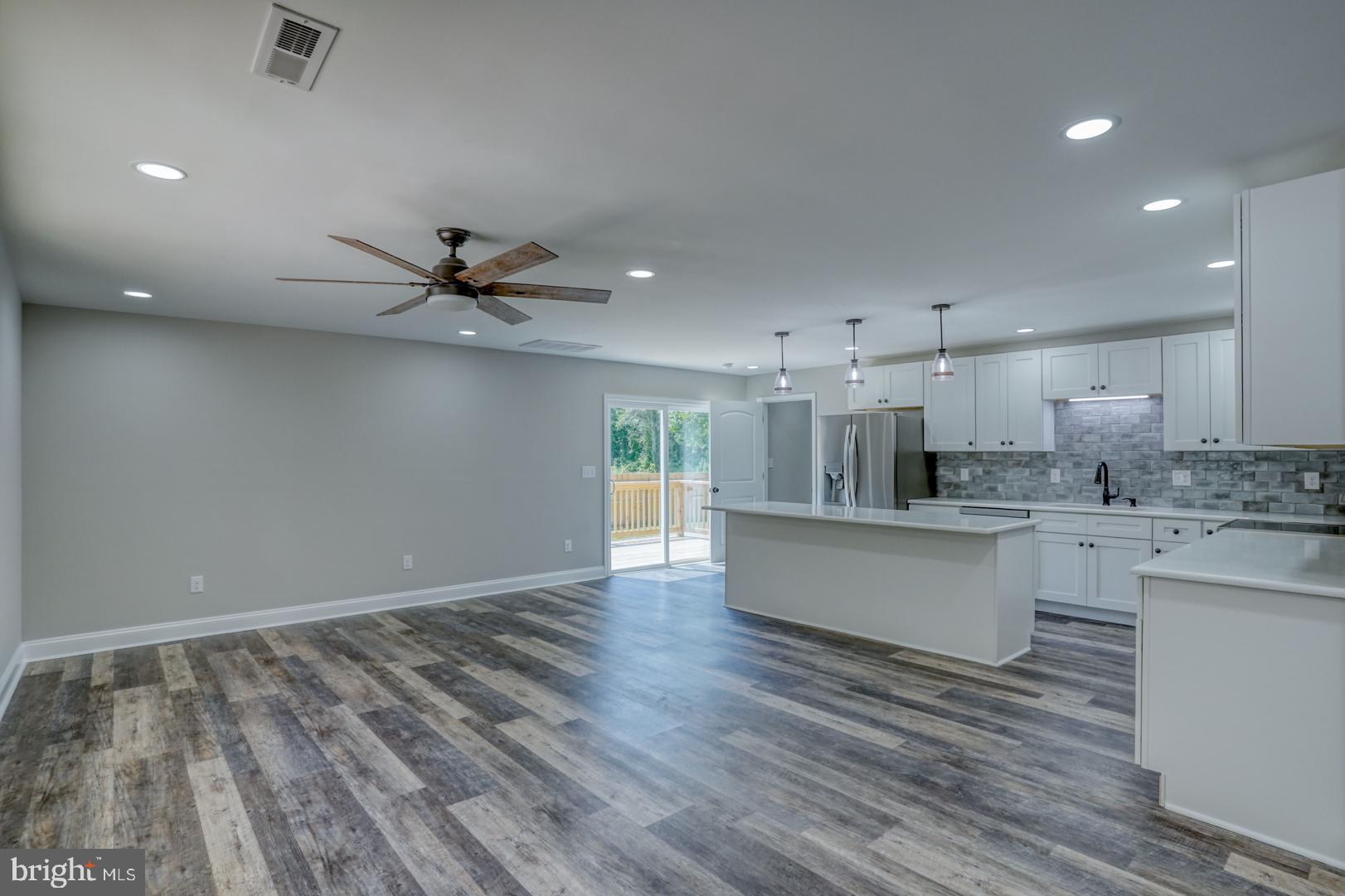 67 Morgans Choice Road Camden Wyoming, DE 19934 - Photo 16 of 56 a view of kitchen with wooden floor and window