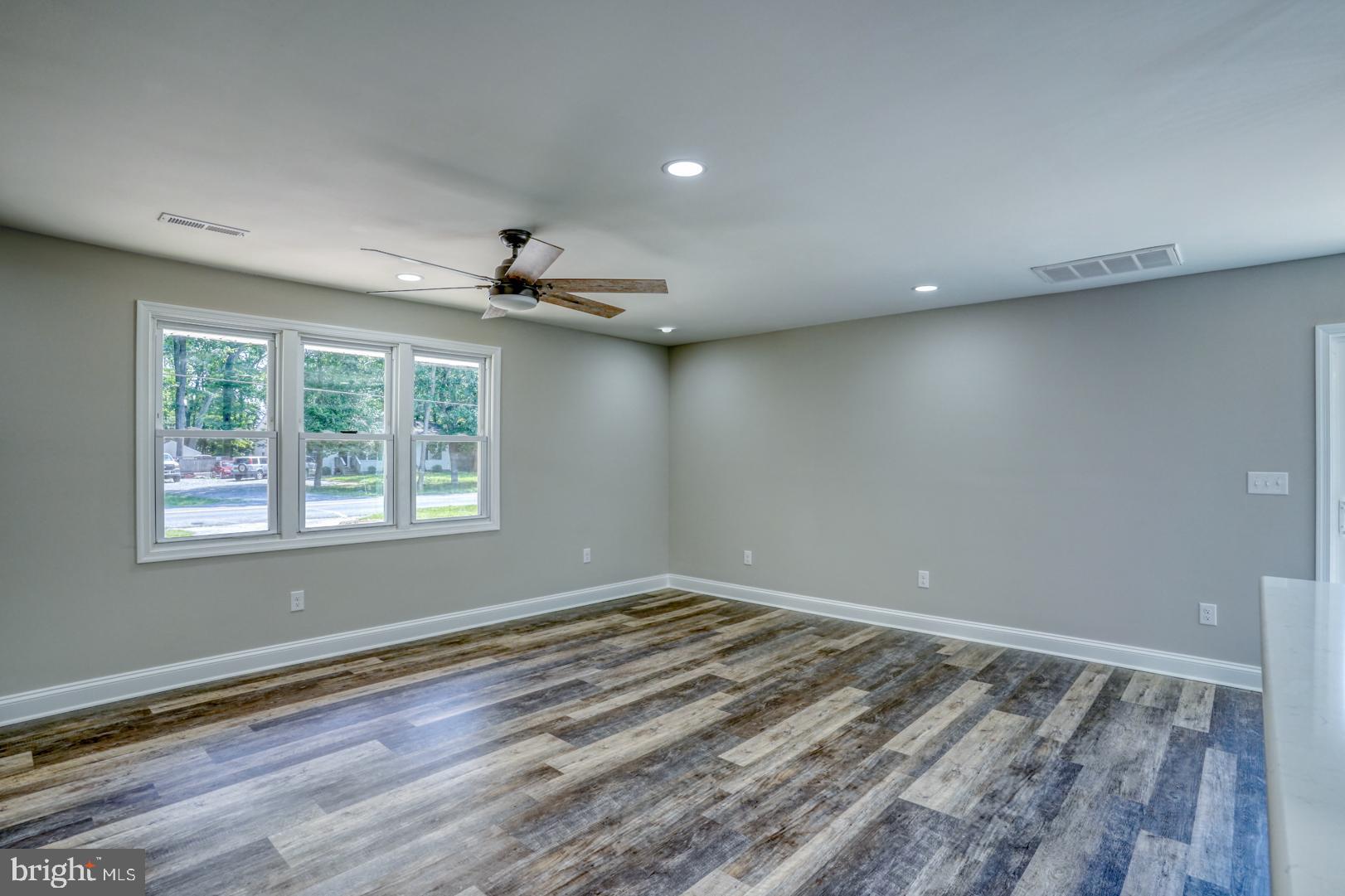 67 Morgans Choice Road Camden Wyoming, DE 19934 - Photo 17 of 56 wooden floor in an empty room with a window