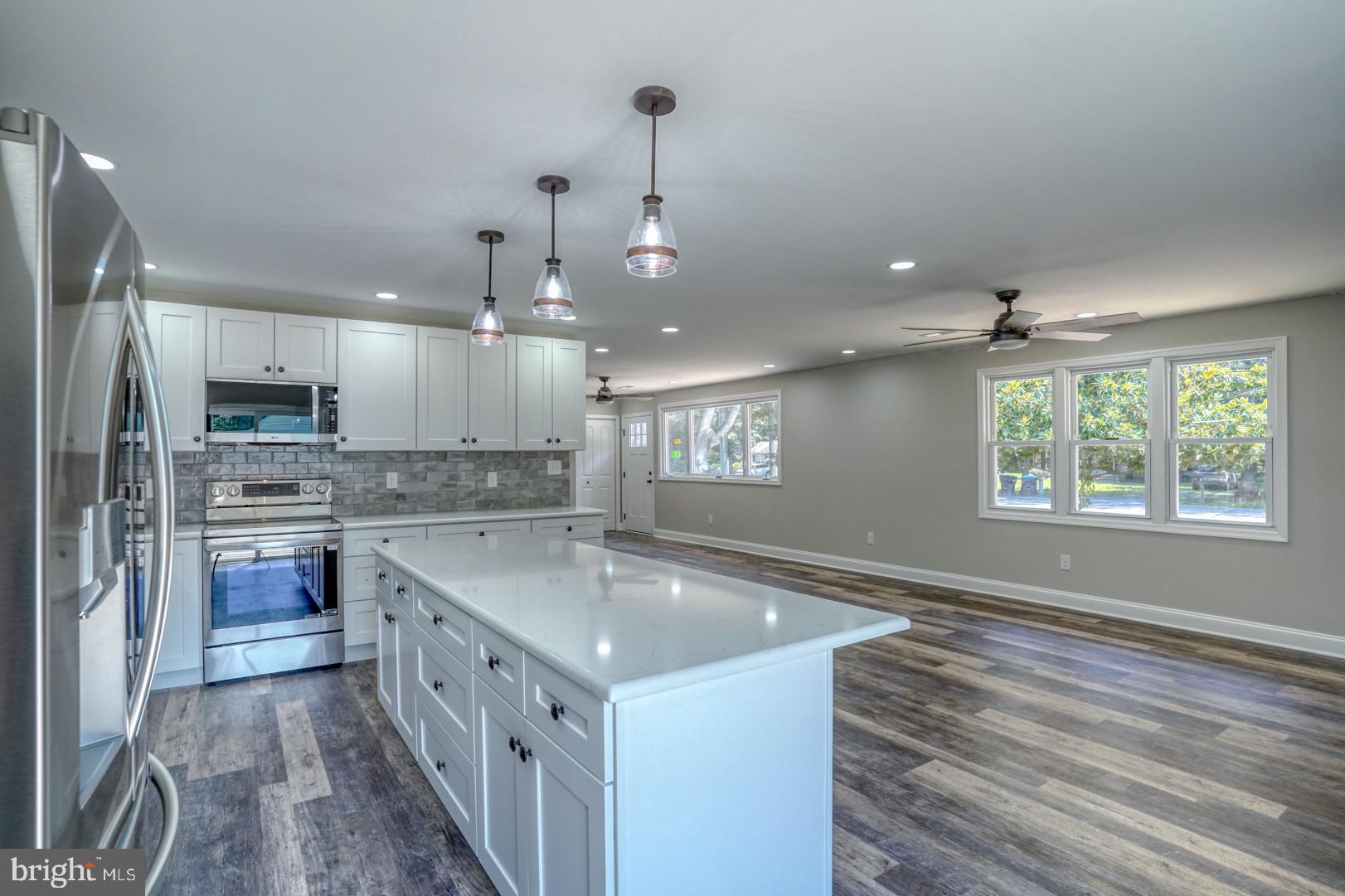 67 Morgans Choice Road Camden Wyoming, DE 19934 - Photo 22 of 56 a kitchen with stainless steel appliances granite countertop a sink stove and refrigerator
