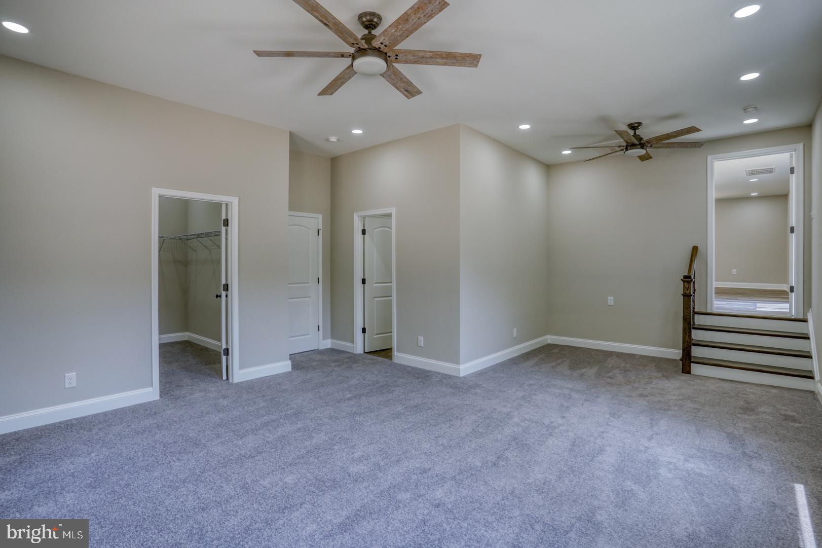 67 Morgans Choice Road Camden Wyoming, DE 19934 - Photo 25 of 56 an empty room with closet and a chandelier fan