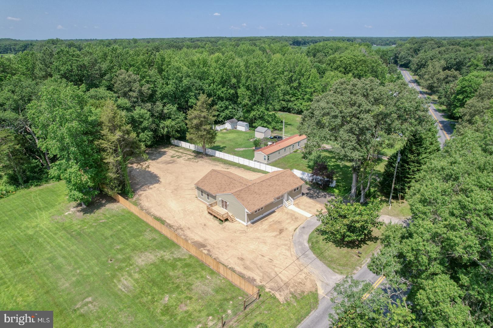 67 Morgans Choice Road Camden Wyoming, DE 19934 - Photo 3 of 56 a view of a backyard with plants and a yard