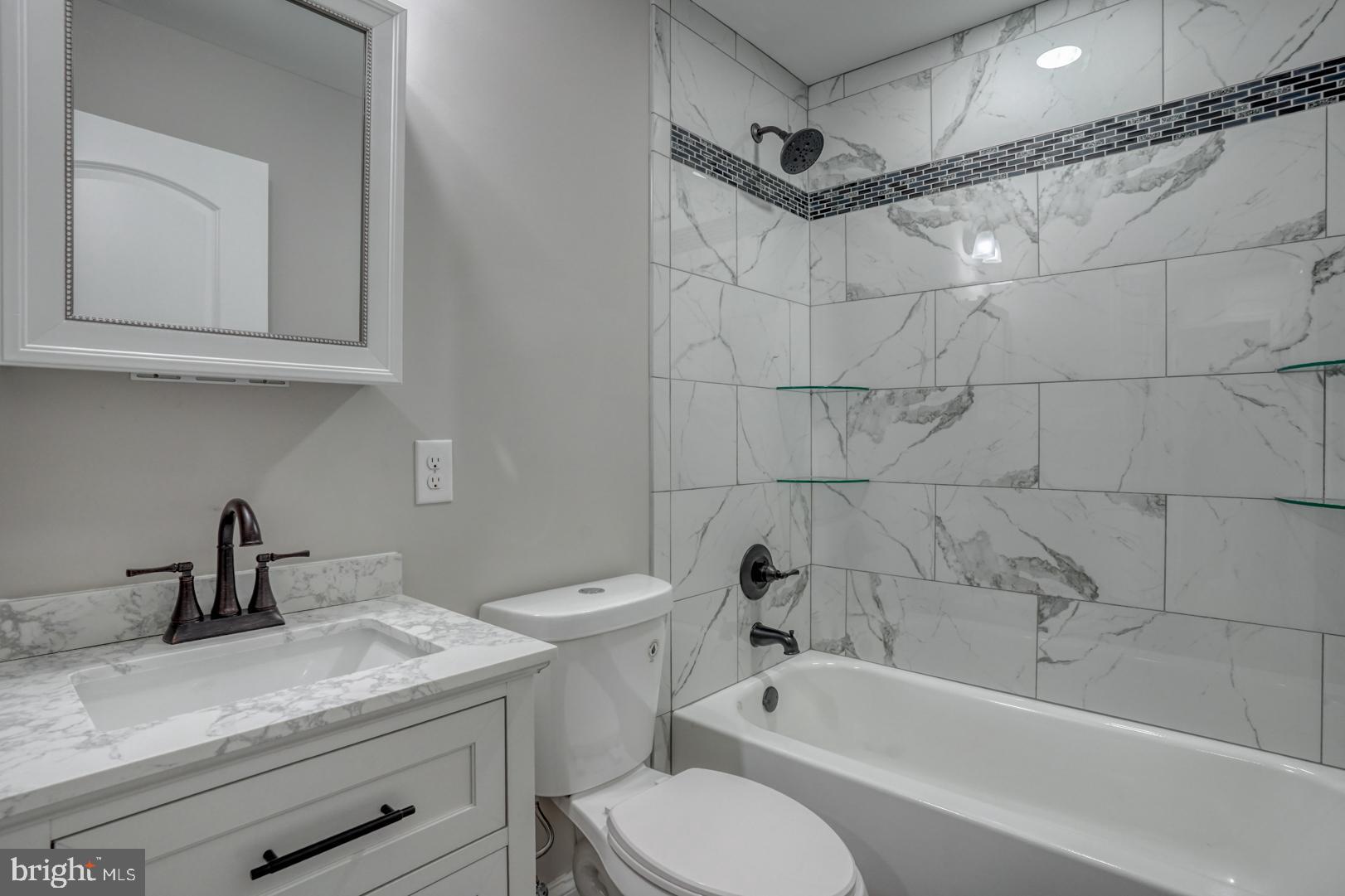 67 Morgans Choice Road Camden Wyoming, DE 19934 - Photo 37 of 56 a bathroom with a sink a toilet and bathtub