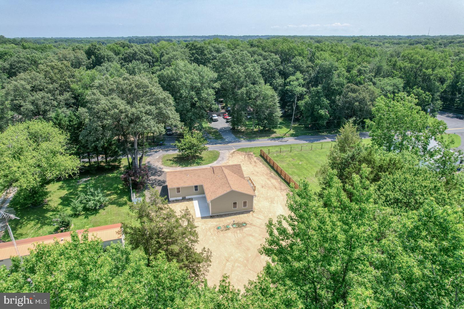 67 Morgans Choice Road Camden Wyoming, DE 19934 - Photo 40 of 56 an aerial view of a house with a yard and lake view