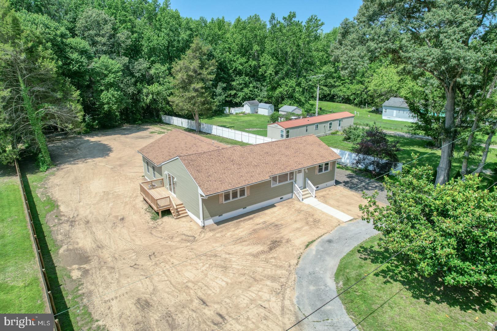 67 Morgans Choice Road Camden Wyoming, DE 19934 - Photo 4 of 56 an aerial view of a house with swimming pool and large trees
