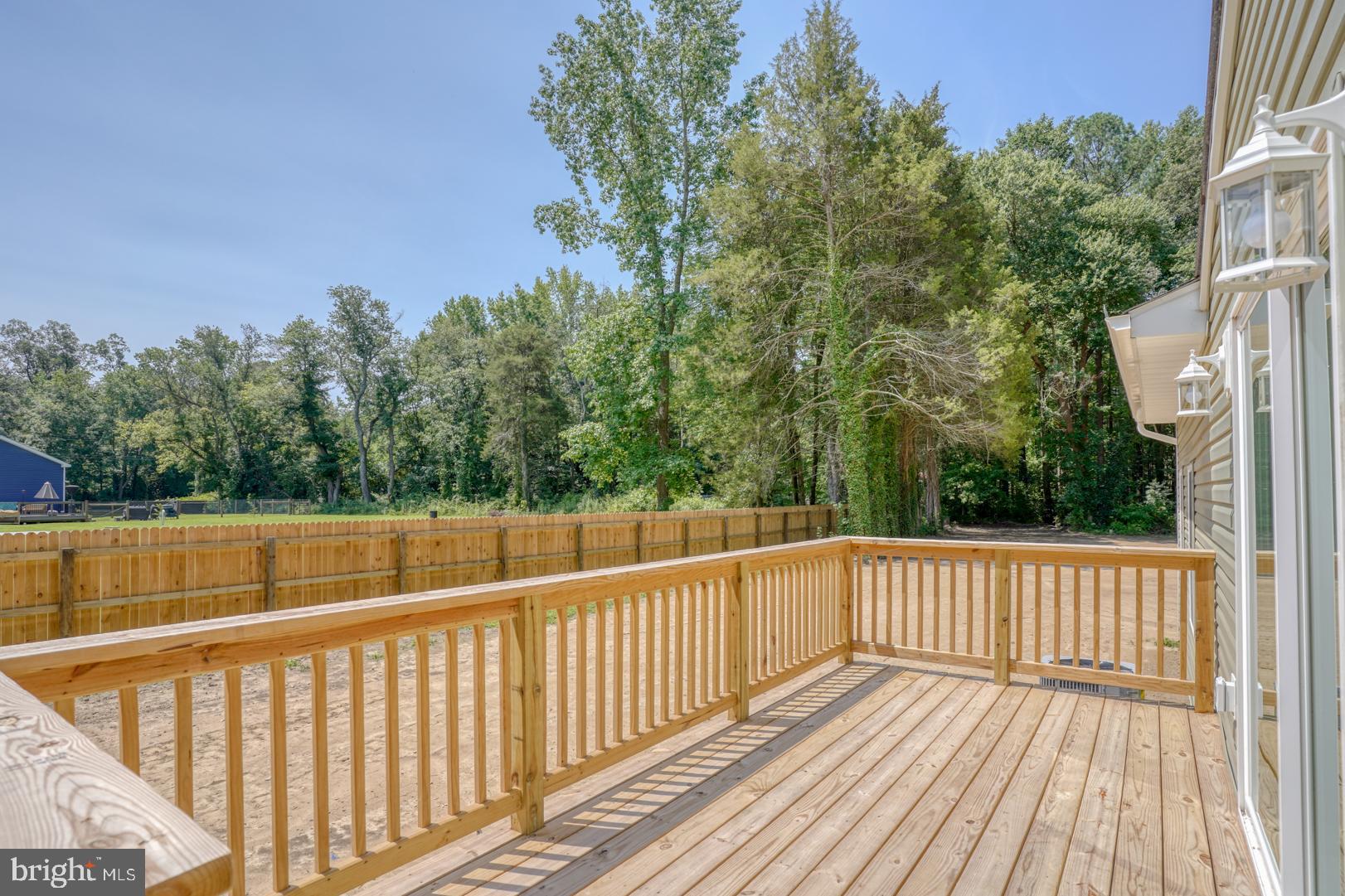 67 Morgans Choice Road Camden Wyoming, DE 19934 - Photo 44 of 56 a view of a balcony with wooden floor and fence