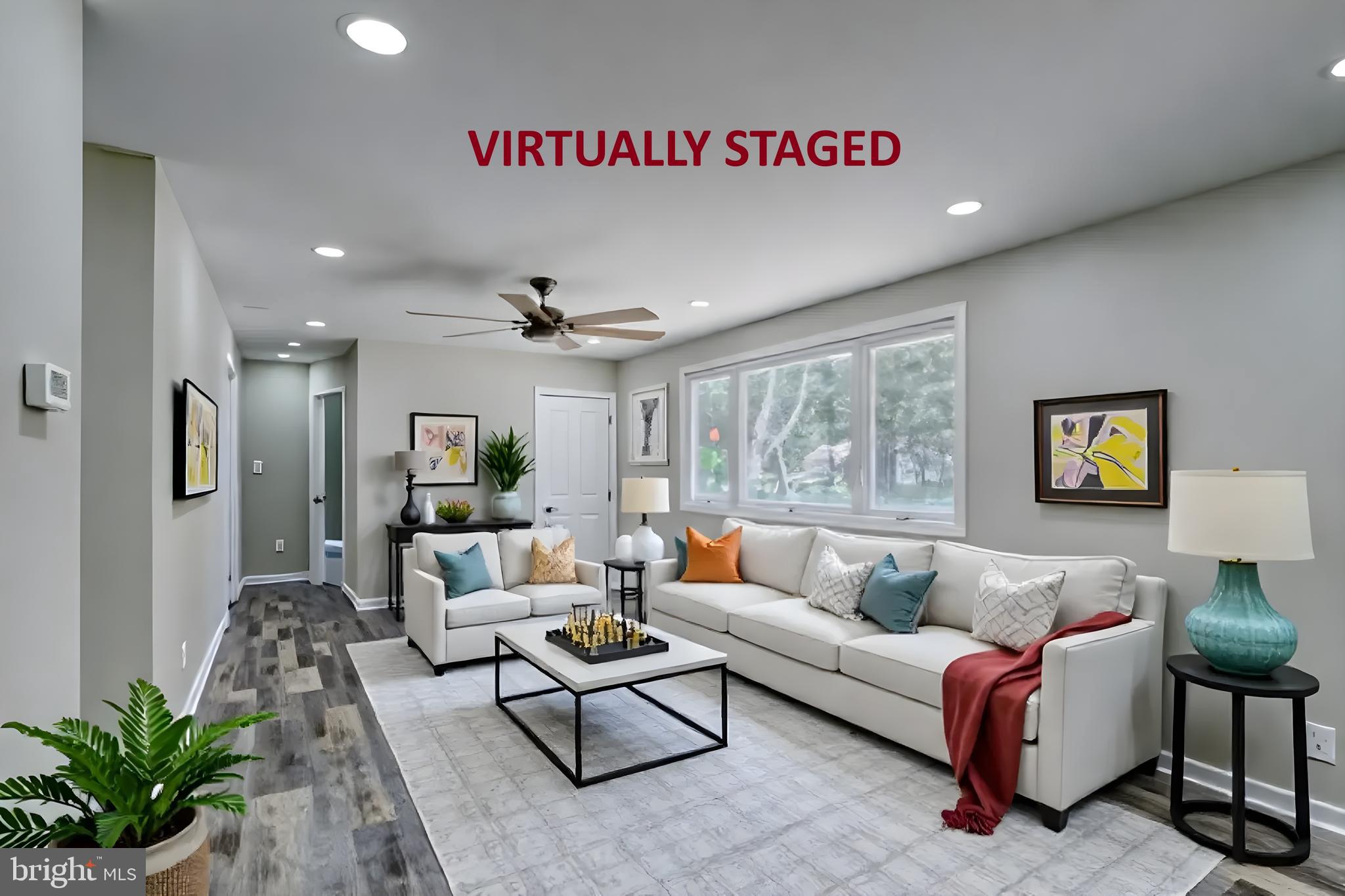 67 Morgans Choice Road Camden Wyoming, DE 19934 - Photo 51 of 56 a living room with furniture and a large window