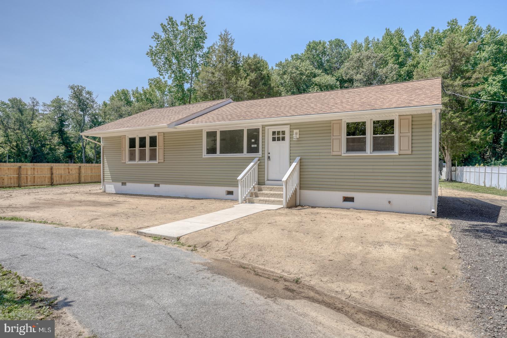 67 Morgans Choice Road Camden Wyoming, DE 19934 - Photo 7 of 56 a view of a house with a backyard and a garage