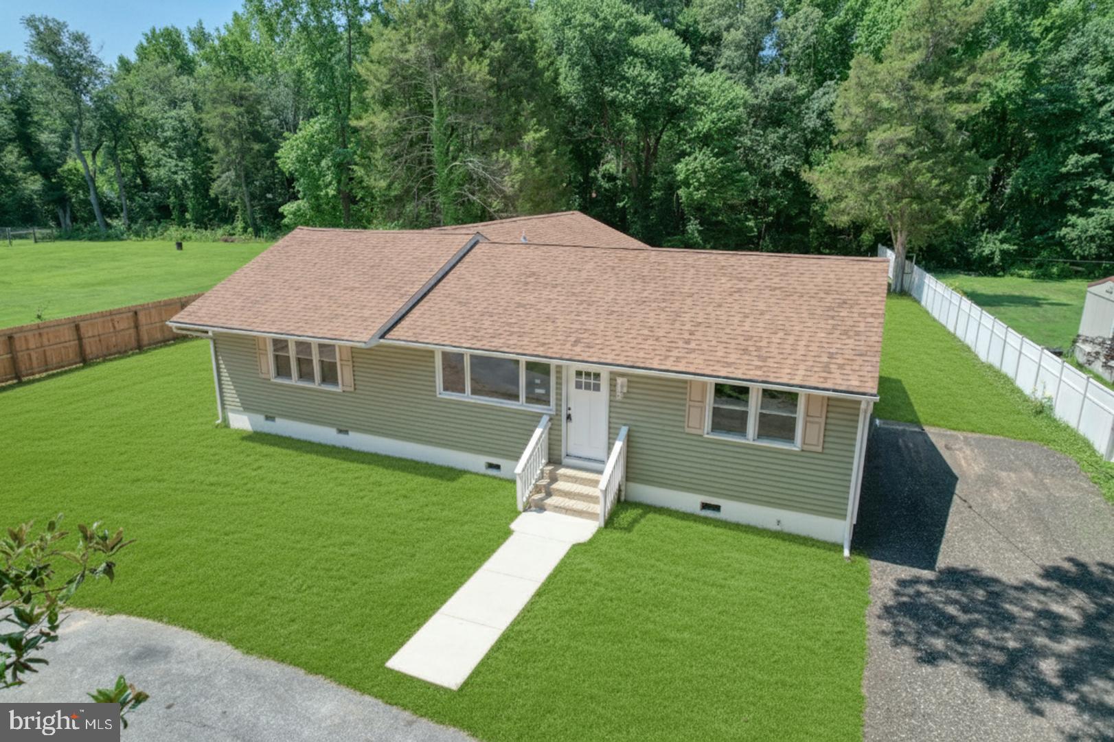 67 Morgans Choice Road Camden Wyoming, DE 19934 - Photo 10 of 56 a aerial view of a house with a yard table and chairs