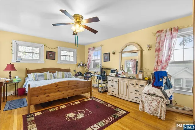 a bed room with a bed and a chandelier