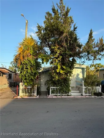 a view of a house with a street