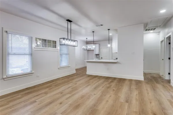 a view of kitchen with wooden floor and window