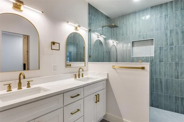 a bathroom with a double vanity sink and a mirror